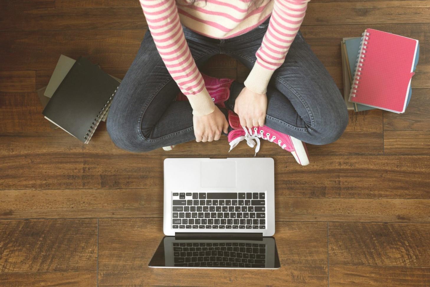 Mobile arcade game development workspace with design mockups and testing devices